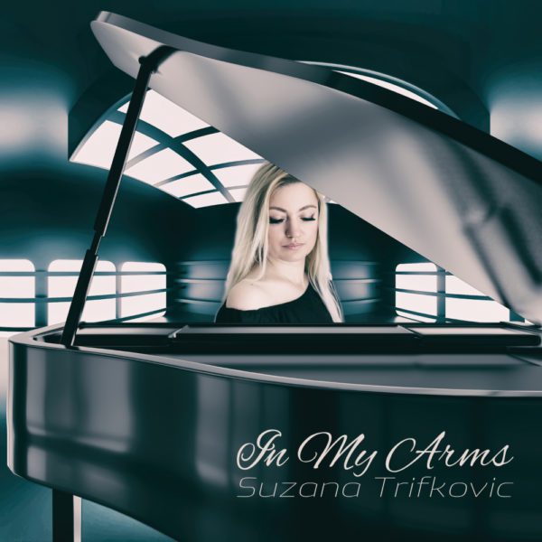 Album cover for "In My Arms" by Suzana Trifkovic, portrait of Suzana sitting behind grand piano